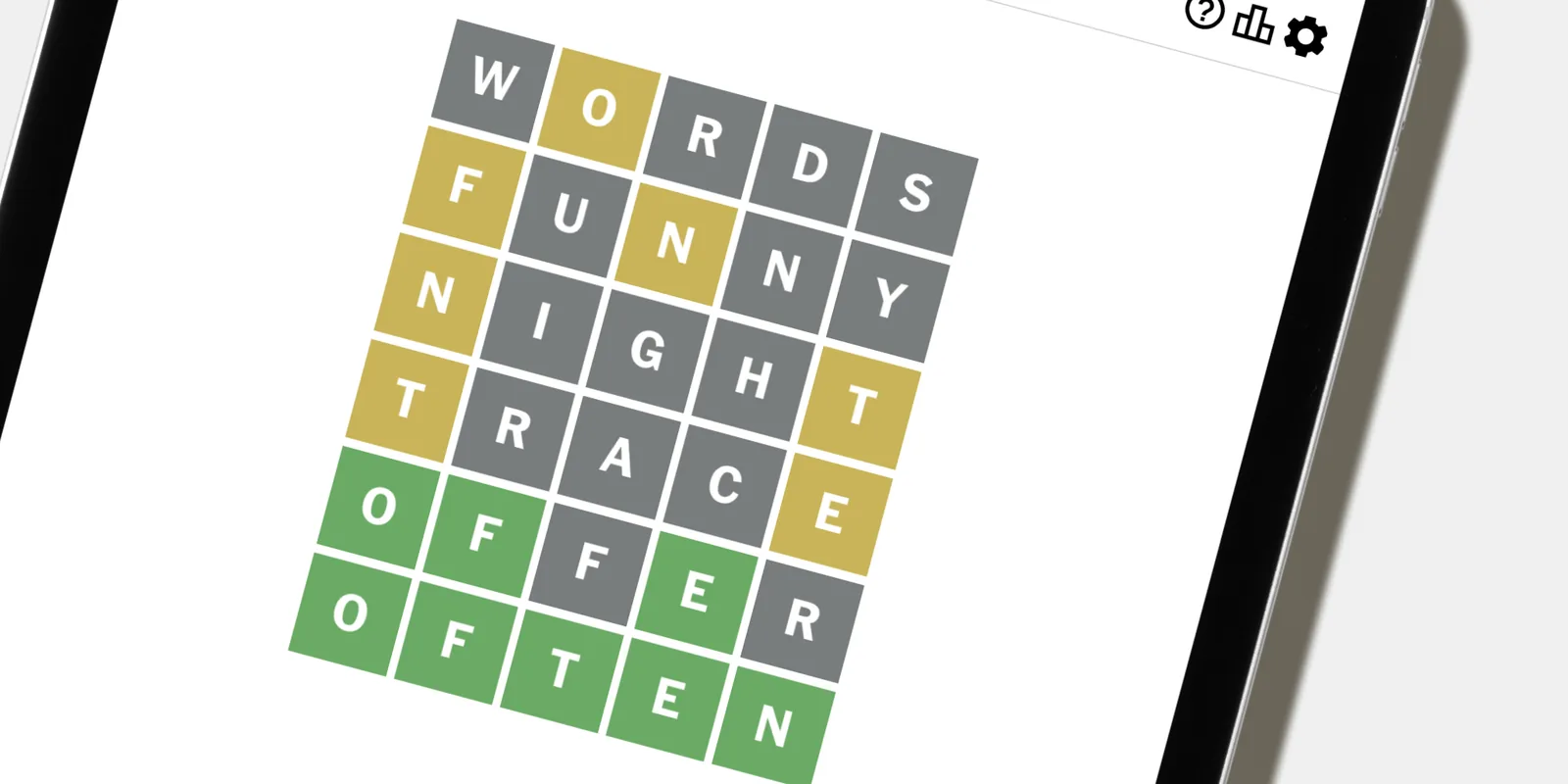 Wordle on an iPad: a finished grid of green, yellow and grey tiles ending in OFTEN